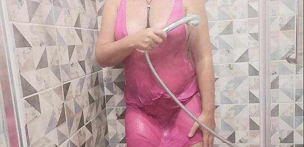  MILF teases you in a see-through dress in the shower and masturbates to a strong orgasm.